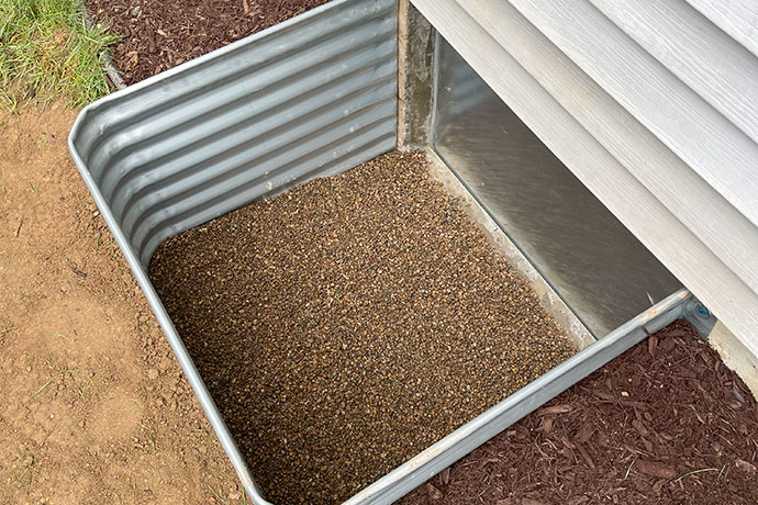 Crawl space access door outside of a house